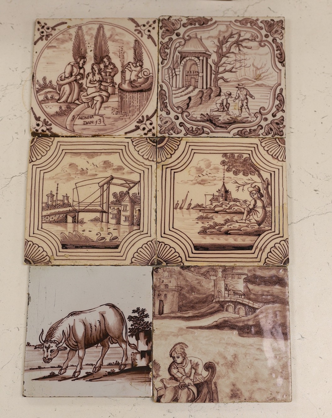 Six Delft manganese tiles, 18th century, each decorated with figures or animals in landscapes, five 12.5 cm